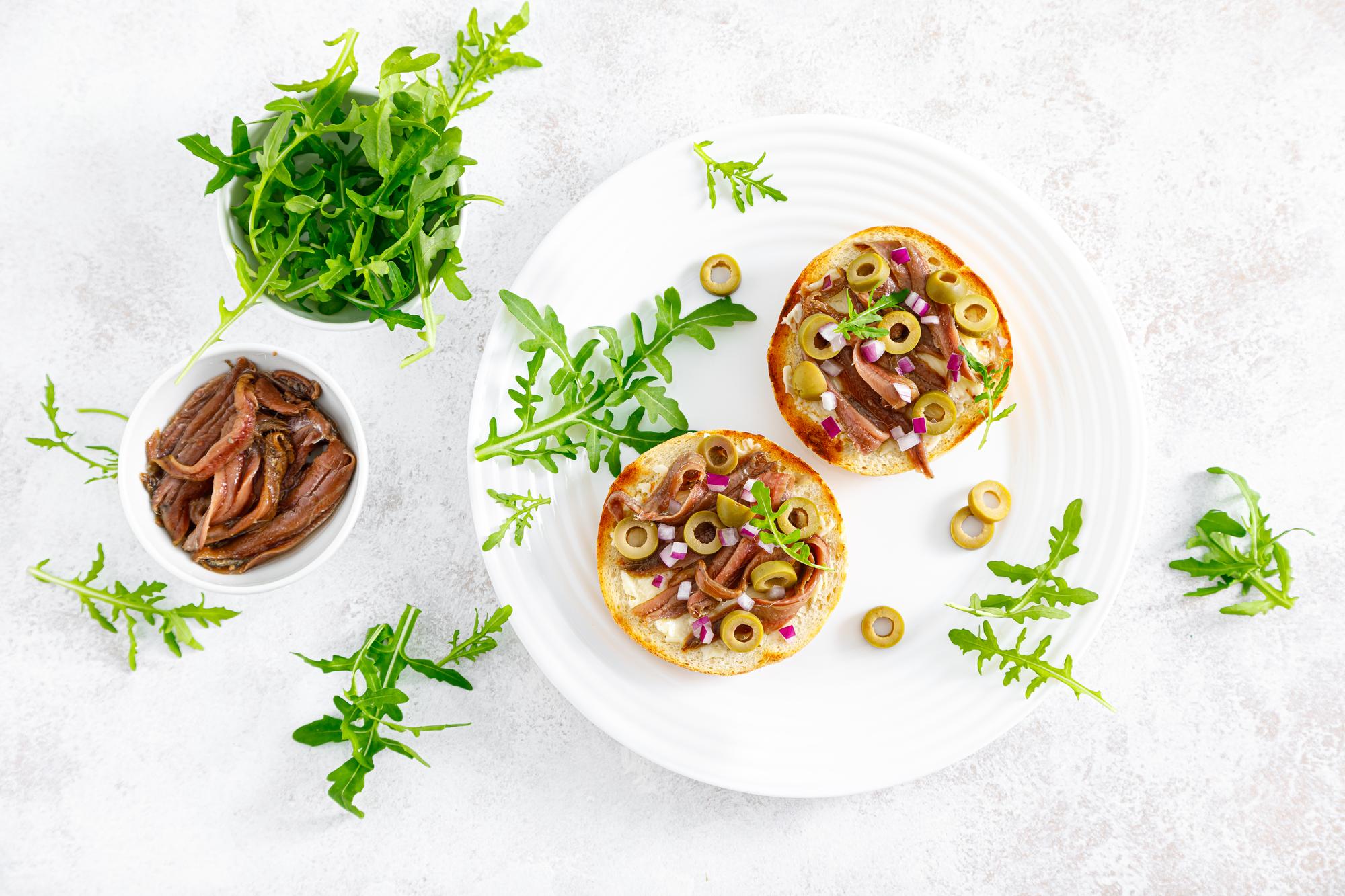 Table setting with plated appetizers and herbs